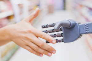 robot and human hands in handshake, high tech